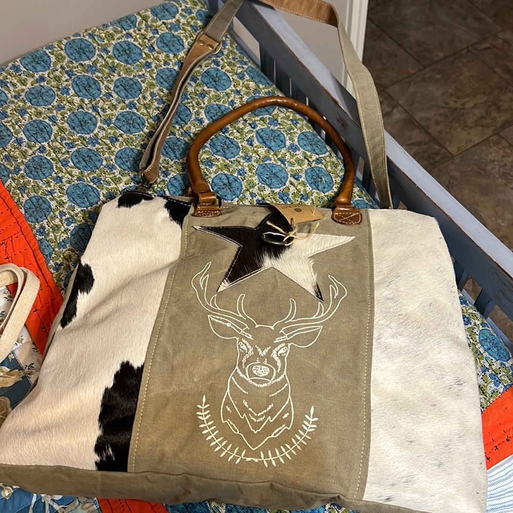 Very large Clea Ray tote bag made from canvas and faux cowhide hide.
